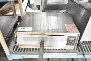 Wisco 425 Countertop Pizza Oven, 120 Volts, 1 Phase. Stainless steel exterior, digital display, visible caution label.