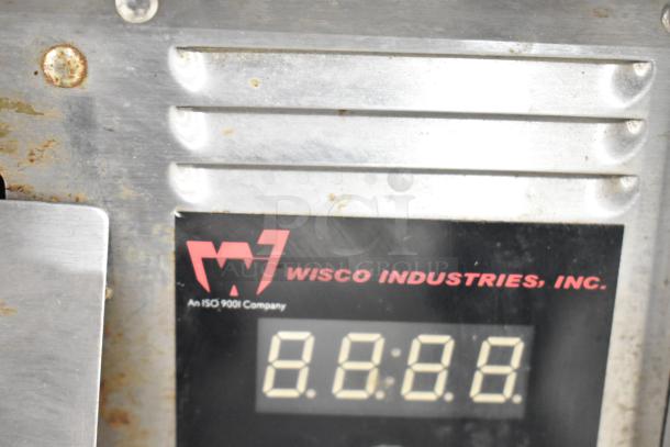 Wisco 425 countertop pizza oven, 120V, 1 phase, displays visible digital interface and Wisco Industries branding.