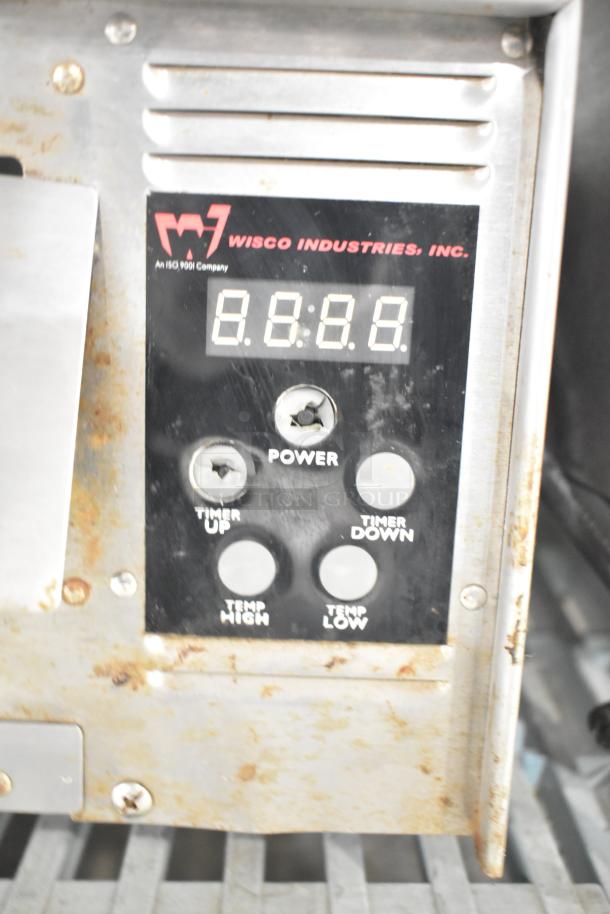 Wisco 425 countertop pizza oven control panel, shows power, timer, and temperature buttons, 120 volts, used condition.
