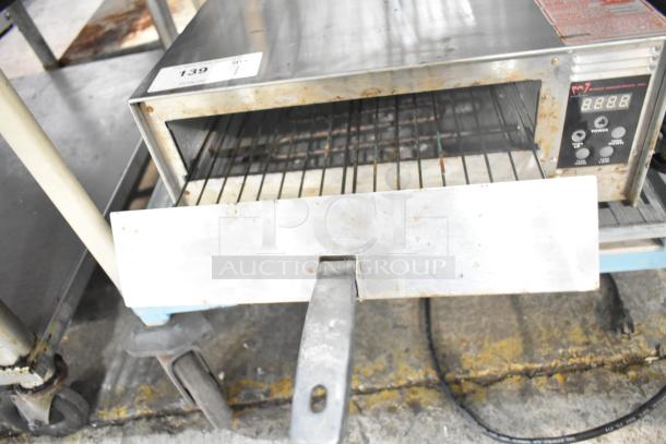 Wisco 425 countertop pizza oven, 120 volts, 1 phase, showing some signs of wear, with visible controls and rack.