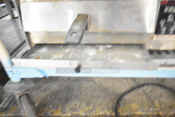 Wisco 425 countertop pizza oven, 120 volts, 1 phase, used condition, showing wear on the exterior and faded controls.