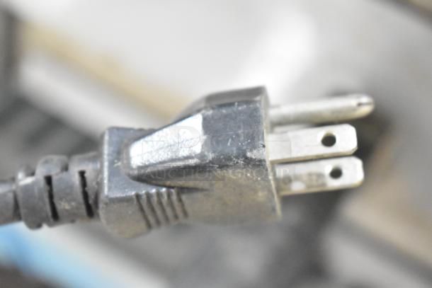 Close-up of the plug for a Wisco 425 countertop pizza oven. Runs on 120 volts, 1 phase.