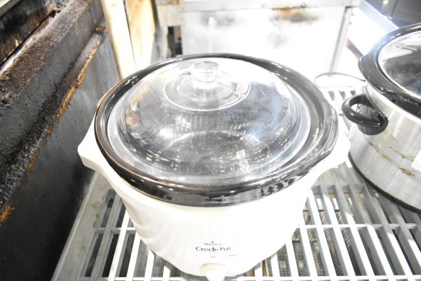 Two slow cookers, including Rival 3950 and Crock Pot SCV803-SS. 120 volts, 1 phase, good condition.