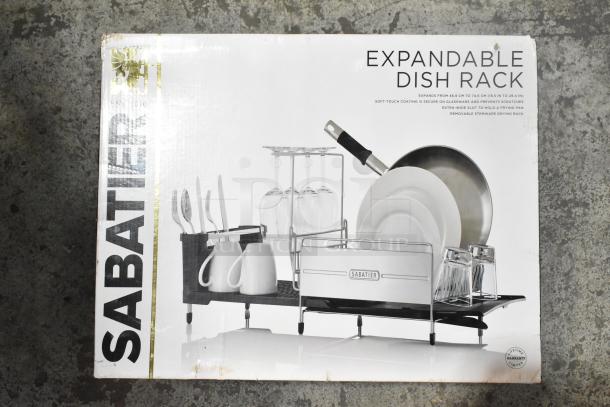 Brand new Sabatier expandable dish rack in box, scratch and dent condition, features soft-touch coating and removable drying rack.