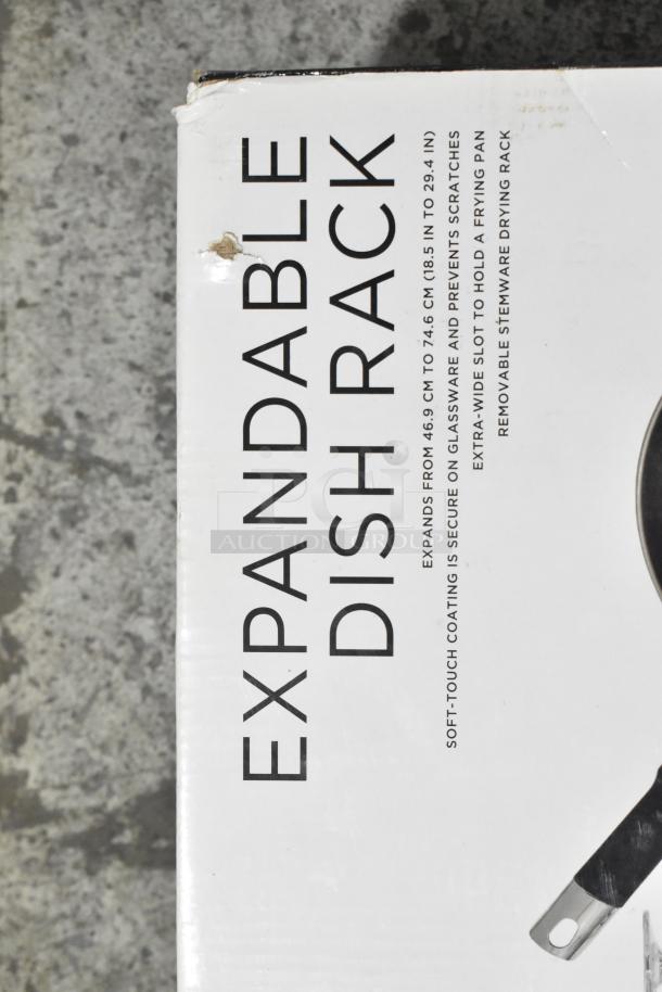 Brand new Sabatier expandable dish rack, scratch and dent. Soft-touch coating, expands from 18.5 to 29.4 inches. Box shows minor damage.