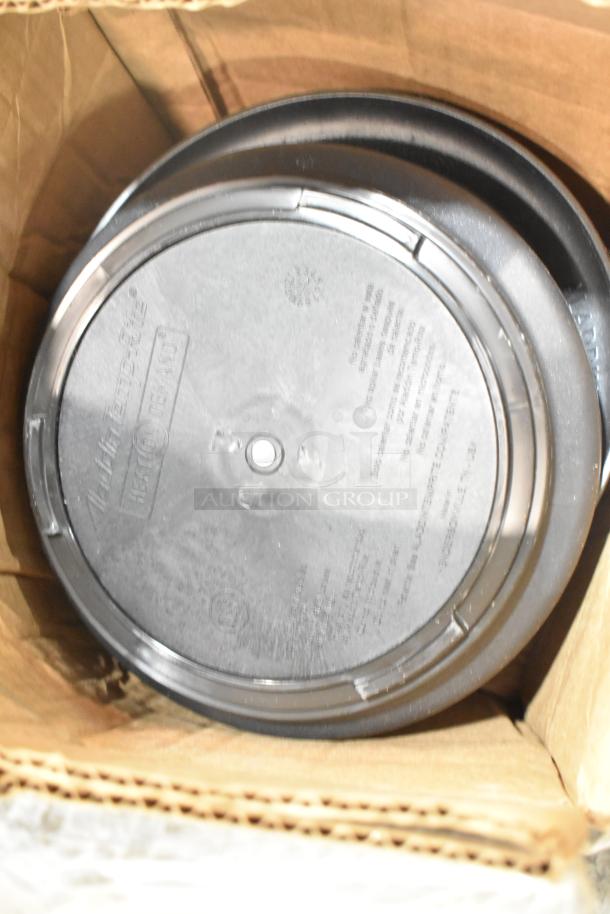 Box containing Aladdin Temp-Rite black poly trays with visible logo and details in used condition.