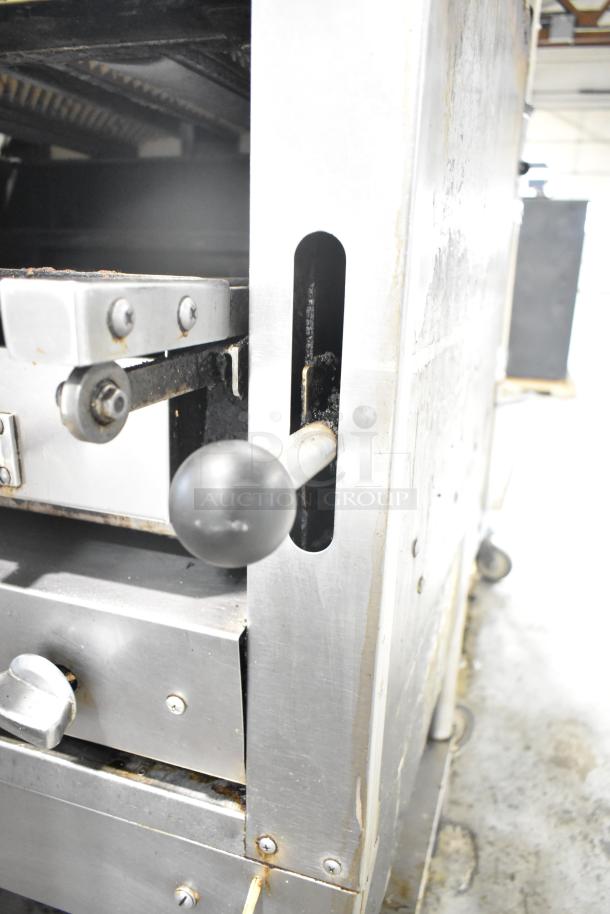 Montague C36SHB Legend commercial steakhouse broiler, natural gas, 42,000 BTU, on casters, stainless steel, minor wear visible.