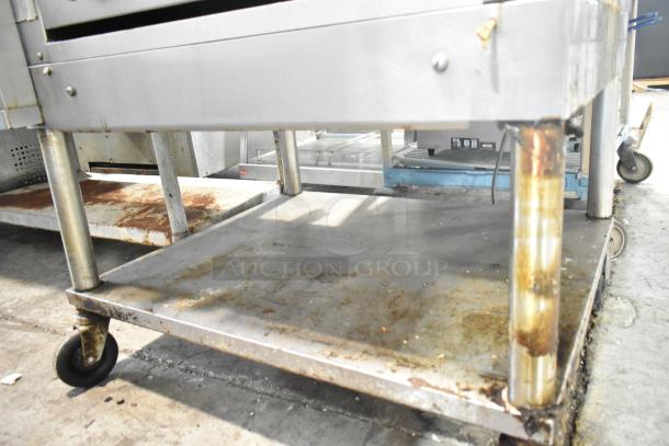 Montague C36SHB Legend steakhouse broiler, natural gas, 42,000 BTU, on commercial casters, showing signs of use.