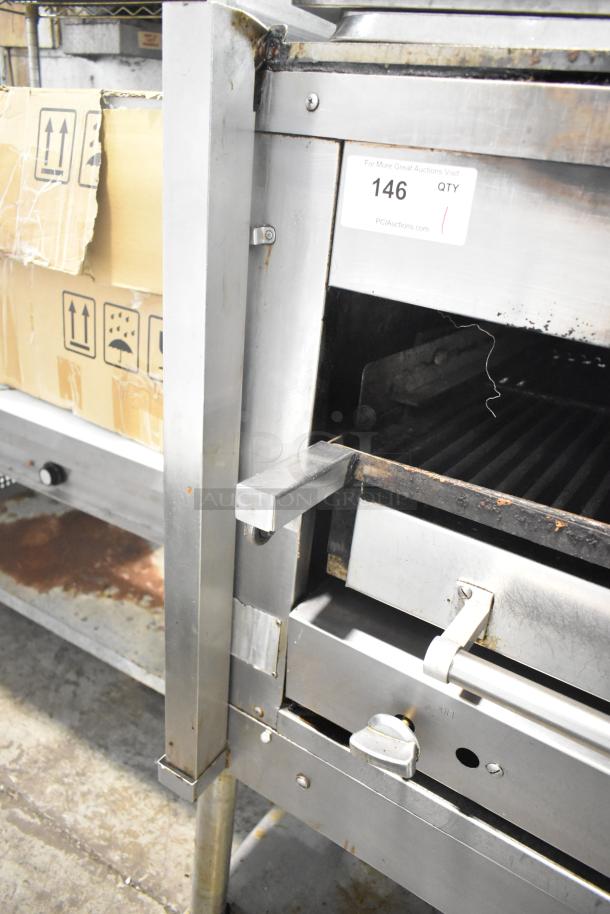 Montague C36SHB Legend commercial gas steakhouse broiler, 42,000 BTU, on casters, with visible auction tag.