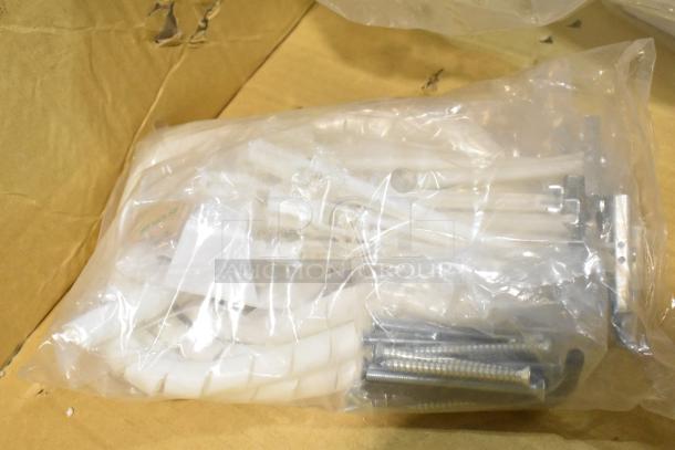 Three new Midmark 6282-001 Shroud Kits in sealed plastic bags, containing hardware components.