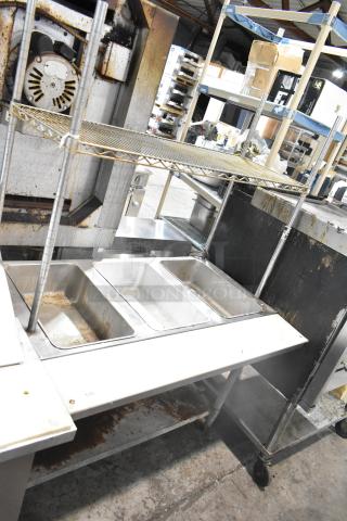 Eagle DHT3-120 commercial electric 3 bay steam table, wire shelf, 120V, used condition, model label visible on side.