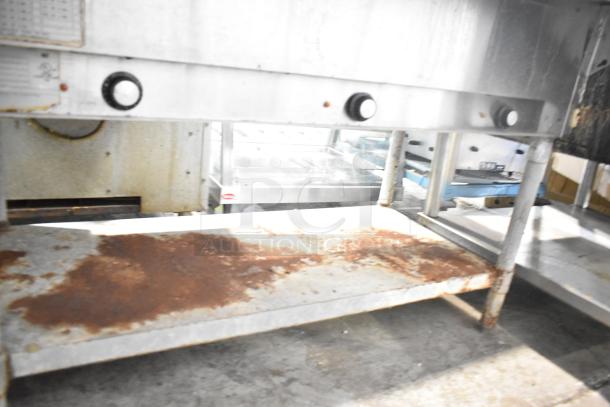 Eagle DHT3-120 commercial electric 3-bay steam table with wire shelf; visible rust; 120V, 1 phase; steel construction.