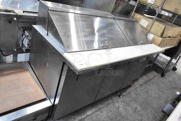 True TSSU-72-30M-B-ST commercial sandwich salad prep table, stainless steel, on casters, medium condition.