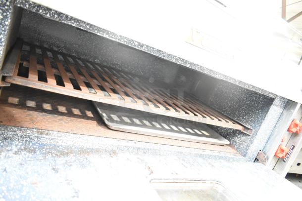 Vulcan V008-T Commercial Electric Pizza Oven, single deck, 208 volts, spacious interior, metal grates, used condition.