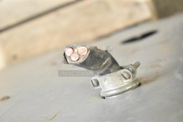 Alt text: Vulcan V008-T commercial pizza oven power connection detail. Electric, 208 volts. Cable wear visible.