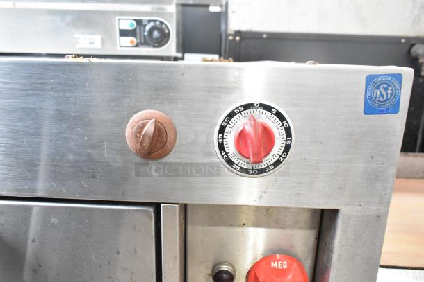 Vulcan V008-T Commercial Electric Pizza Oven, single deck, 208 volts, stainless steel exterior, manual dials visible.
