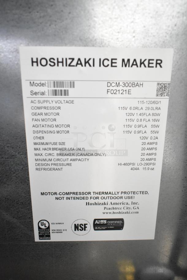 Hoshizaki DCM-300BAH commercial icemaker with ice and water dispenser, 115-120V, 1 phase. Label shows model, serial, specs.