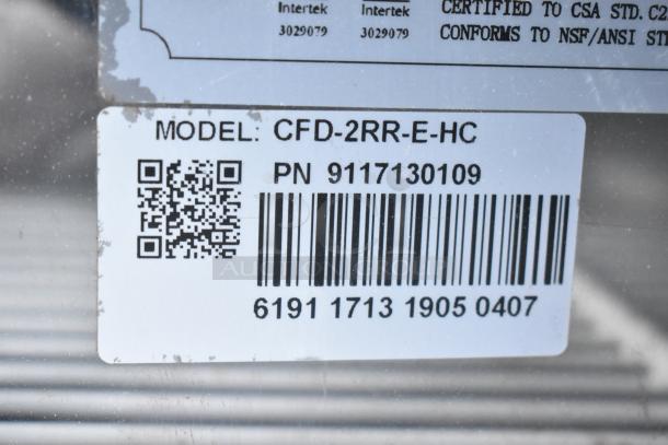 Coldline CFD-2RR-E-HC cooler label, model and part number visible, indicating commercial reach-in unit details.