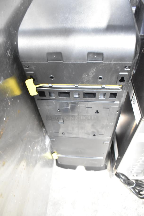 Georgia Pacific Dixie Ultra Z-100274-01 countertop dispenser, black, 3 wells, good condition, visible mounting brackets.