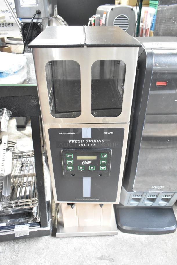 Brand new Curtis ILGD-10 commercial twin 7.5 lb. coffee grinder, 120 volts, 1 phase, with visible controls and markings.