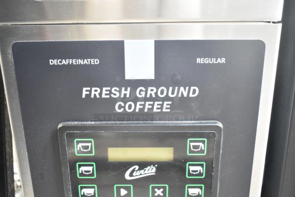 Brand new Curtis ILGD-10 commercial twin coffee grinder, 7.5 lb capacity, 120V, minor scratches. Decaf and regular options.