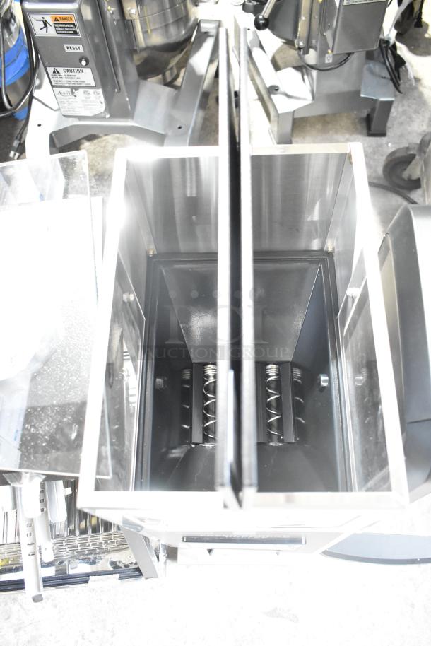 Brand new Curtis ILGD-10 twin coffee grinder, 7.5 lb. capacity, 120 volts, minor scratches and dents visible.