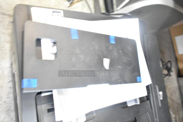 Epson WF-7840 Scanner Copier Printer on countertop, 100-120V, 1 Phase. Appears in good condition with papers on tray.