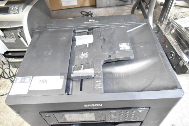 Epson WF-7840 scanner copier printer, 100-120V, 1 phase. Features adjustable guides, minor surface wear, model label visible.