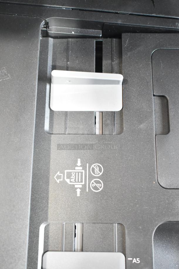 Epson WF-7840 scanner copier printer tray with paper alignment and handling icons displayed.