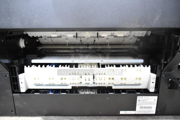 Epson WF-7840 scanner copier printer, interior view. Model and voltage details visible on label. 100-120V, 1 phase.