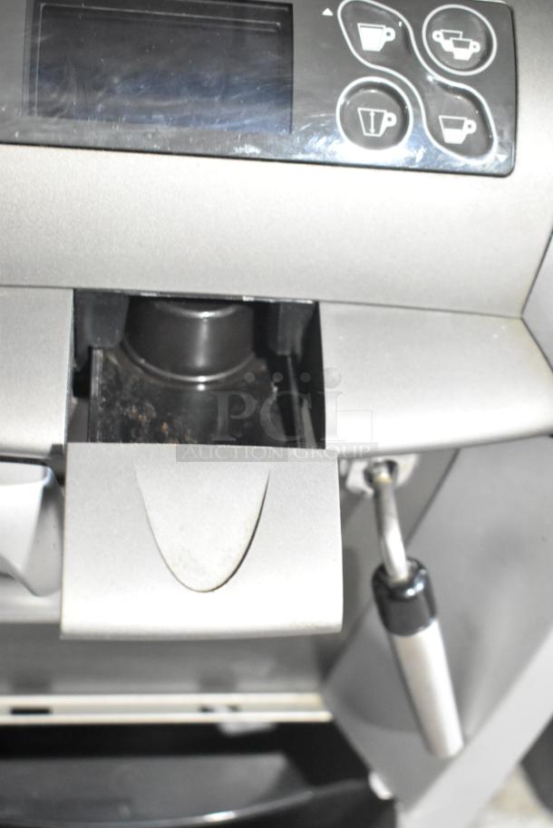 LavAzza Pininfarina LB2312 espresso machine, silver, showing control panel and spout, 120V, countertop model.
