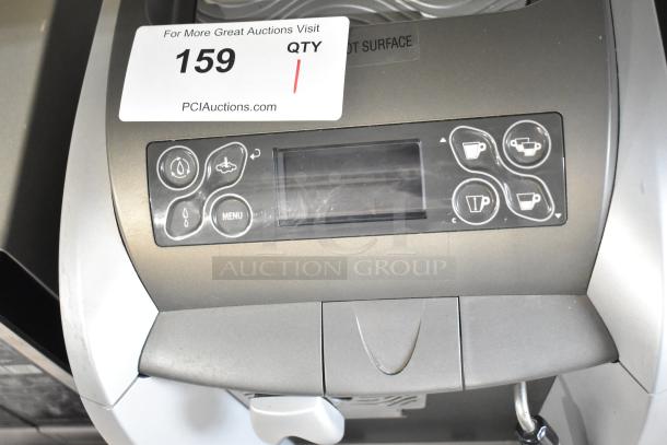 LavAzza Pininfarina LB2312 countertop espresso machine. Features control panel and display. 120 Volts, 1 Phase.