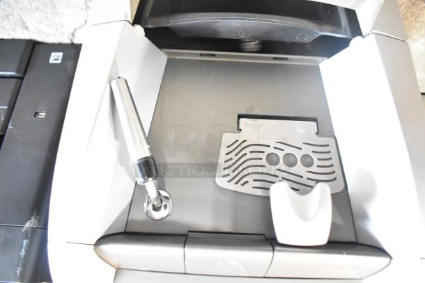 LavAzza Pininfarina LB2312 espresso machine, countertop model, with steam wand, drip tray, and power specs: 120V, 1 Phase.