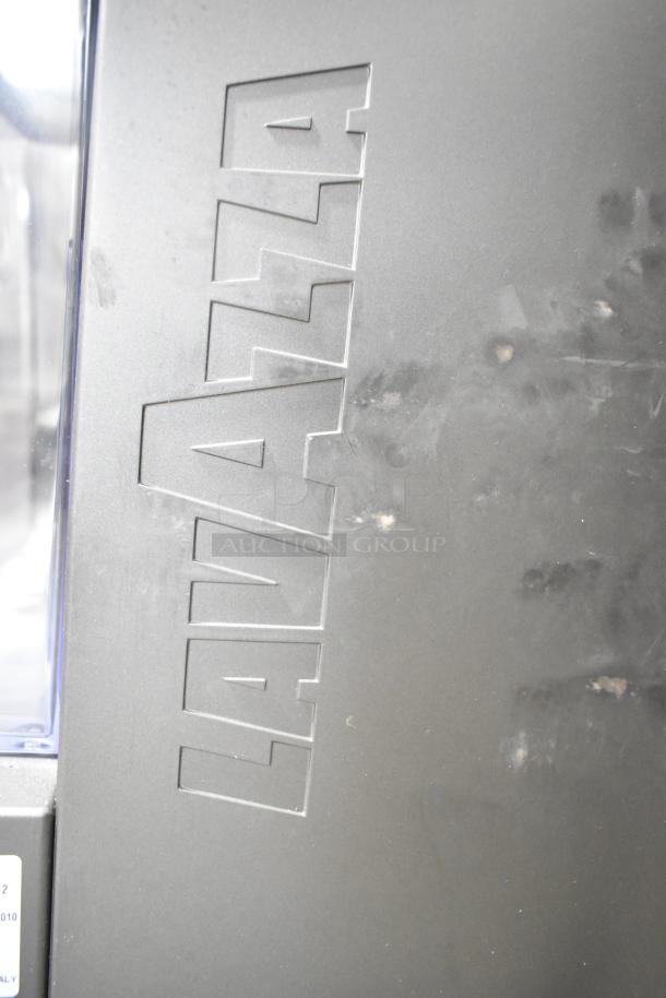 LavAzza Pininfarina LB2312 countertop espresso machine, logo detail. Features 120 volts, 1 phase power. Good condition.