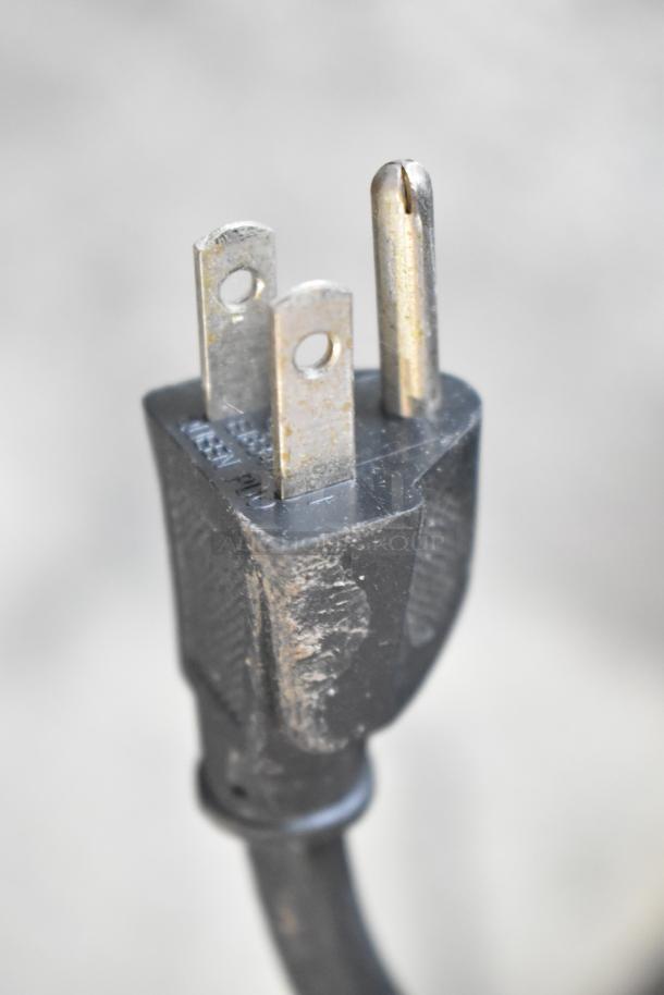 Close-up of a three-prong electrical plug for a LavAzza Pininfarina LB2312 espresso machine. 120V, 1 Phase.