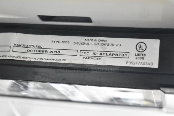 2018 Panasonic NN-SA651S Countertop Microwave Oven label showing model, manufactured October 2018, made in China.