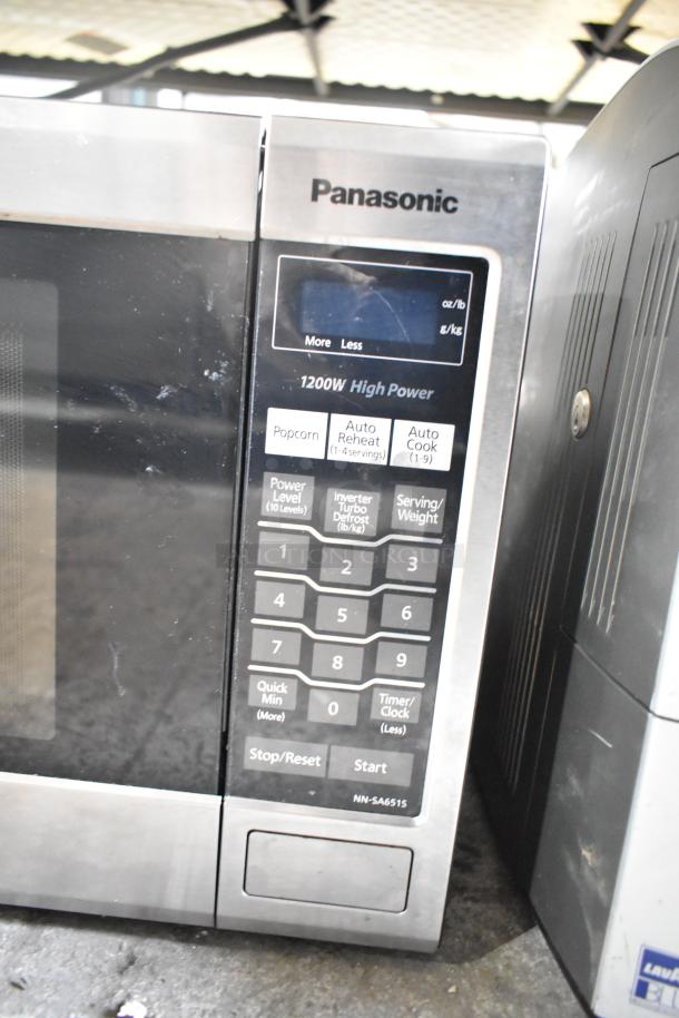2018 Panasonic NN-SA651S Countertop Microwave, 1200W, well-used condition, visible model label, stainless steel finish.