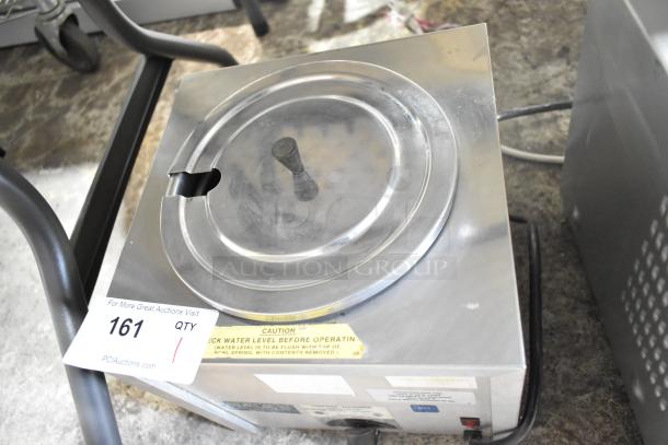 Gold Medal 2191 Countertop Cheese Warmer in used condition. Stainless steel finish, 120 volts, 1 phase. Visible caution label.