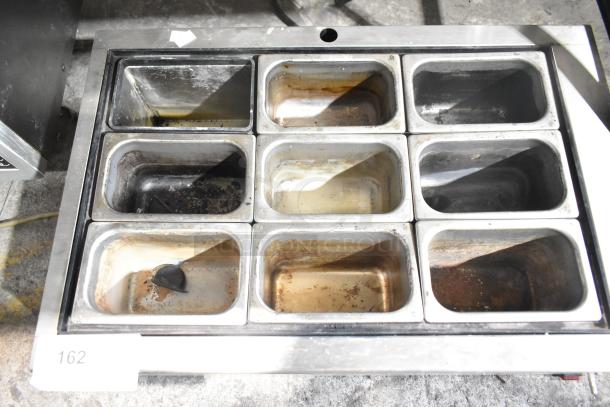 Brain Power Inc DRS1090 Automatic 4-Stroke Gradient Lensor; used condition, stainless steel pans, visible wear. Model: DRS1090.