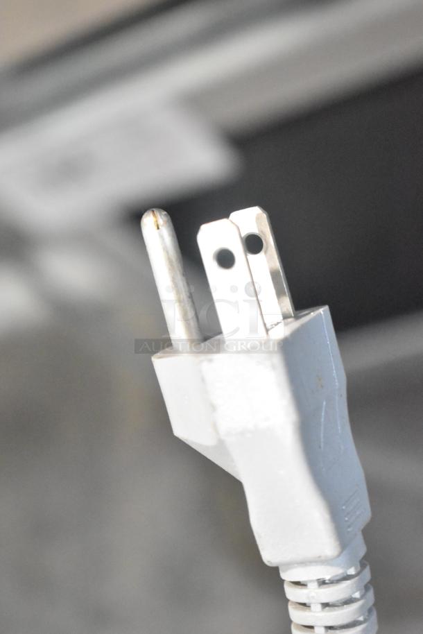 2017 Solwave 180MW1000D Microwave Oven plug, 120V, 1 Phase. Close-up showing power prongs in good condition.