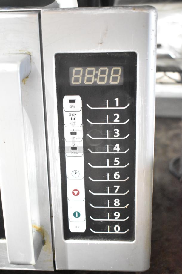 2016 Amana RMS10TS commercial microwave, digital control panel, 120 volts, used condition, minor wear visible.