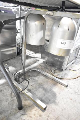 Nemco 6000A-2 countertop lamp warmer with two heads, 120 volts, visible wear, auction tag affixed.