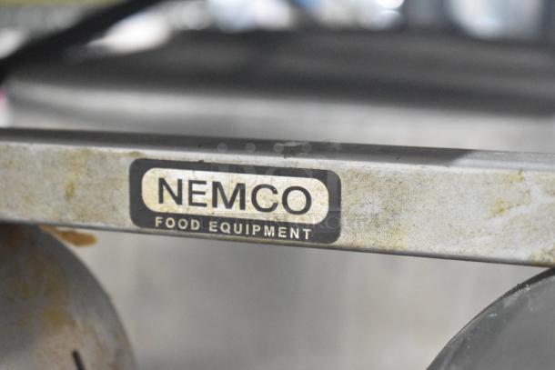 Nemco 6000A-2 countertop lamp warmer in used condition, 2-head, 120 volts, 1 phase, branded label visible.