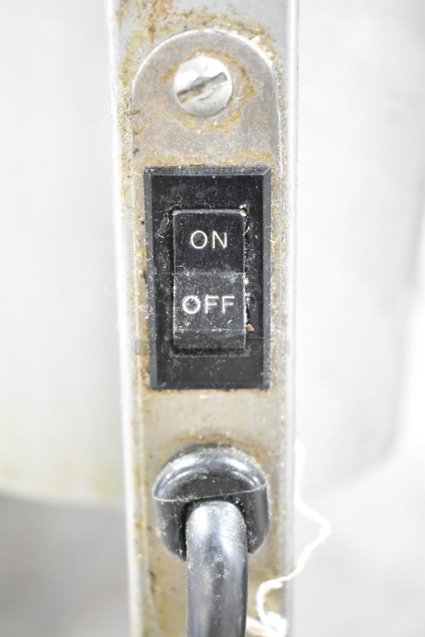 Nemco 6000A-2 countertop lamp warmer, close-up of on/off switch, showing good condition with minor surface wear.