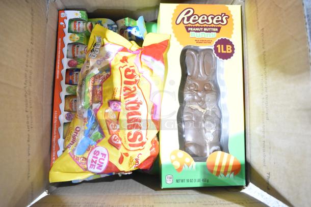 10 boxes of candy including Starbursts, Reese's chocolate bunny, Kinder chocolates, and chocolate pudding Peeps.