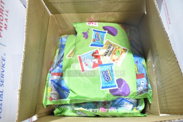 Box of assorted candy including Starbursts, Reese's, Twizzlers, and Haribo Goldbears in new condition.