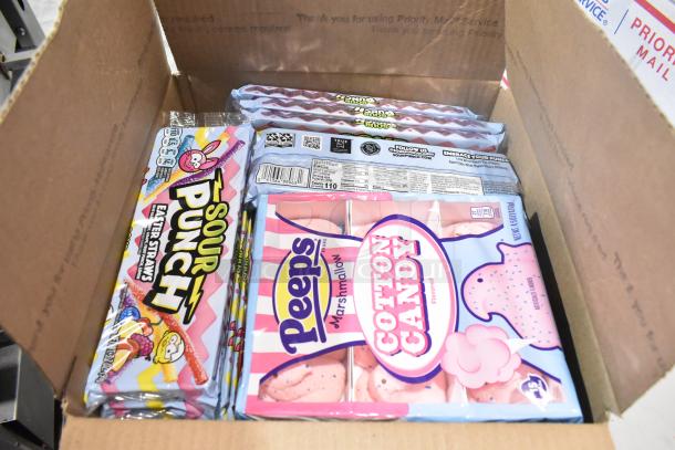 Box containing Sour Punch Easter Straws, Peeps Cotton Candy, and other assorted candies. Includes labels and packaging.