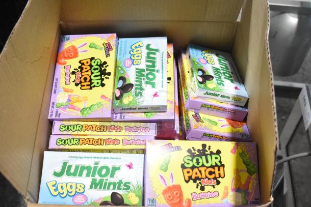 Box with 10 candy packs including Sour Patch Kids Bunnies, Junior Mints Eggs. Various flavors and brands visible.