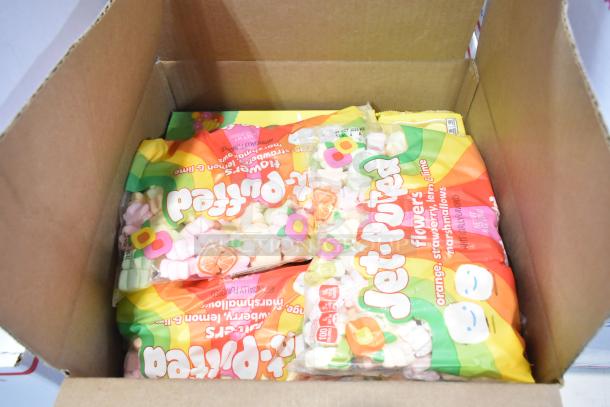 10 boxes of assorted candy, including Sour Punch Twists, Junior Mints, Sour Patch Kids, Jet-Puffed Marshmallows, Reese's.