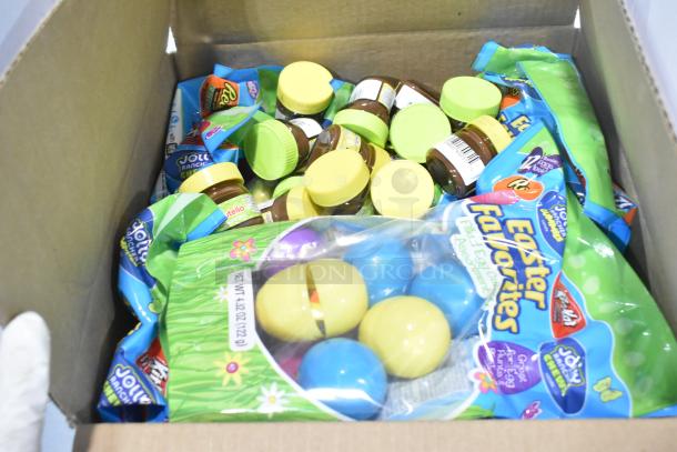 Box of assorted candy with Sour Punch Twists, Junior Mints, Sour Patch Kids, Jif Puffed Marshmallows, Reese's, Jolly Rancher.